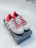 Pair of gray and red adidas TERREX shoes shown on a shoe box
