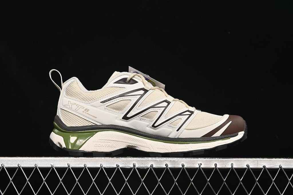 Side profile showing the XT-6 Expanse design and cream, black, brown, and green color details.