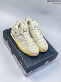 Pair of light sail-toned Air Jordan 4 Retro OG mid-top sneakers with pale yellow accents, displayed on a shoebox.