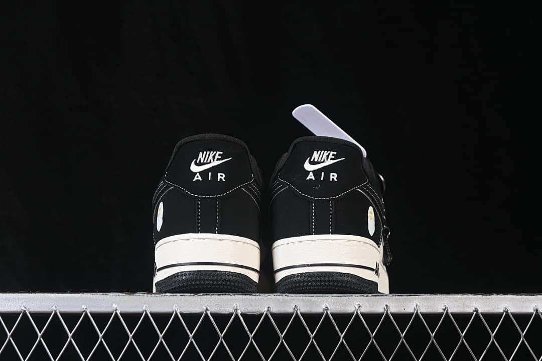 Rear view of both shoes with Nike Air heel branding.