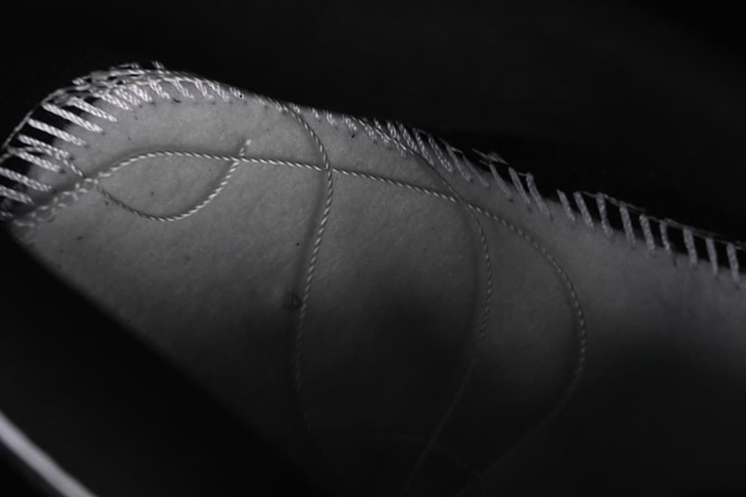 Close-up detail of stitching and panels on the sneaker upper