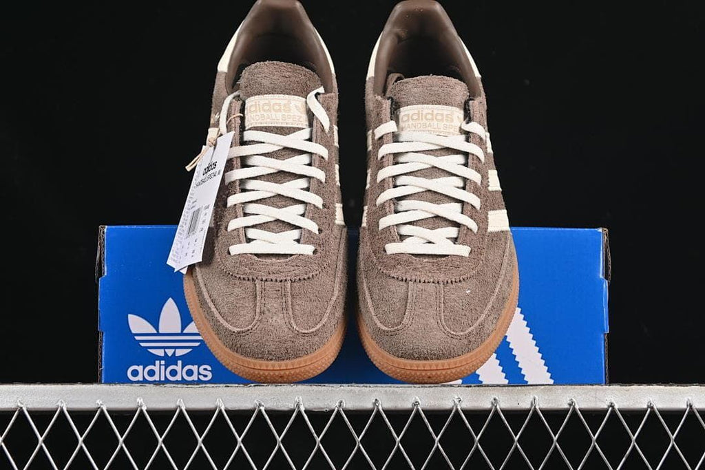 Front view of the pair resting on a blue shoe box.