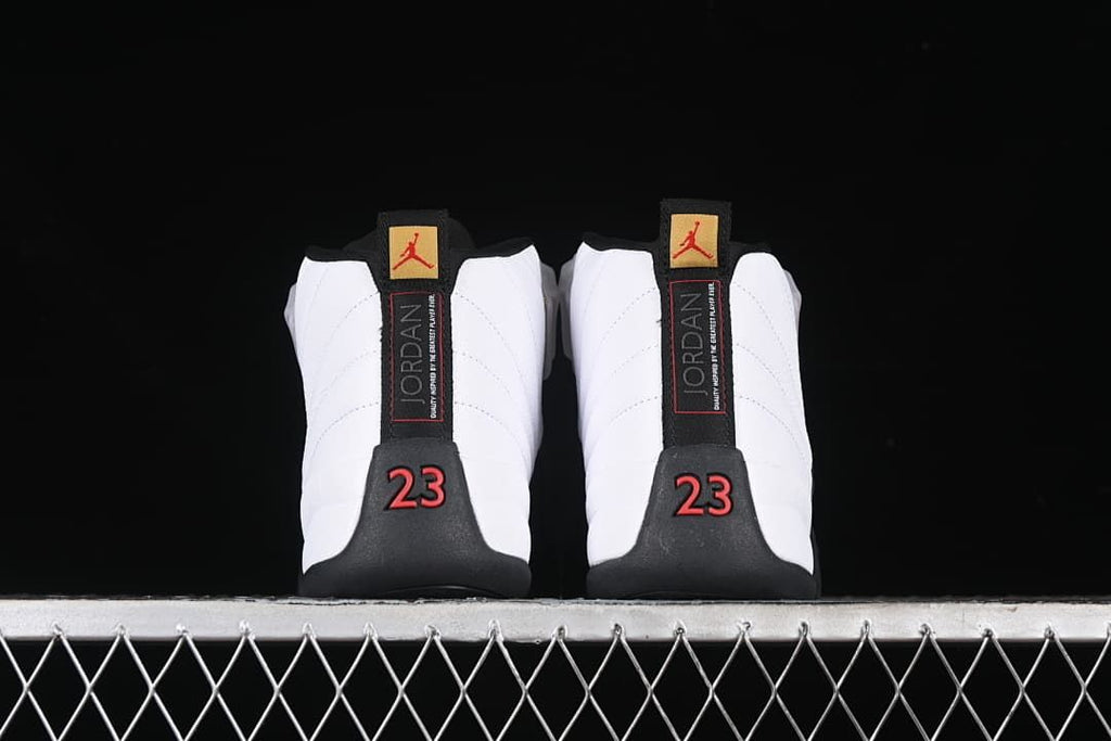 Rear view of the pair showing heel tabs and red number 23 details.
