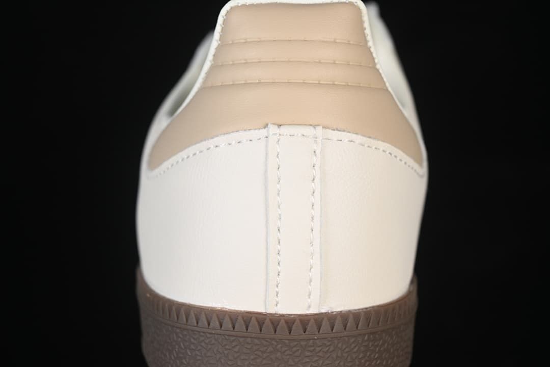 Rear view of the sneaker with a beige heel panel and dark brown sole