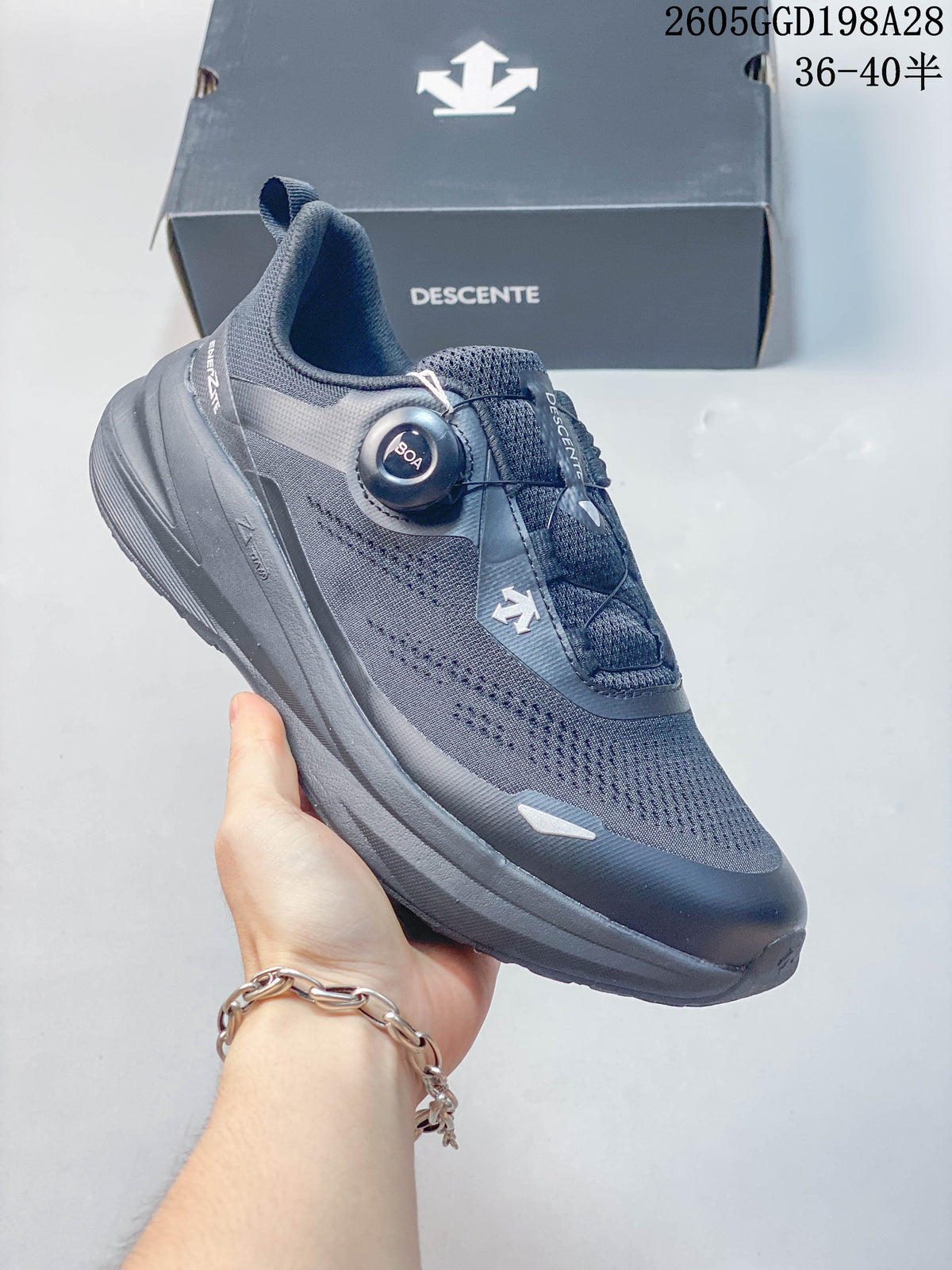 Side view of a gray DESCENTE BOA running shoe