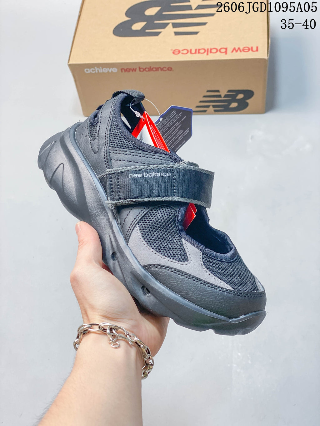 Angled side view of a dark gray New Balance Breeze Mary Jane sneaker