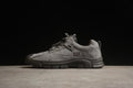 Side view of a gray CAT Tramp Hike Low sneaker with a dark outsole.