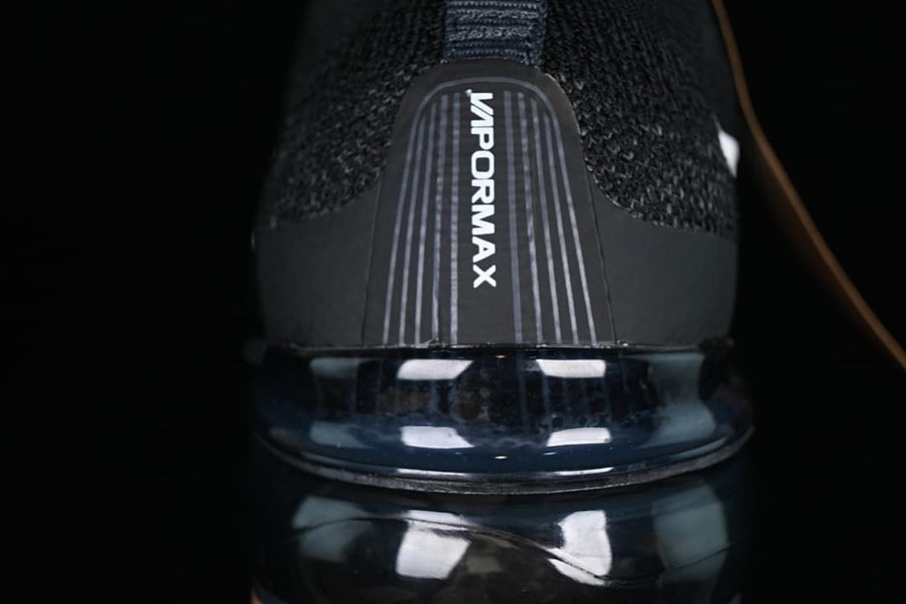 Rear close-up of VaporMax branding above the visible air-cushioned sole.