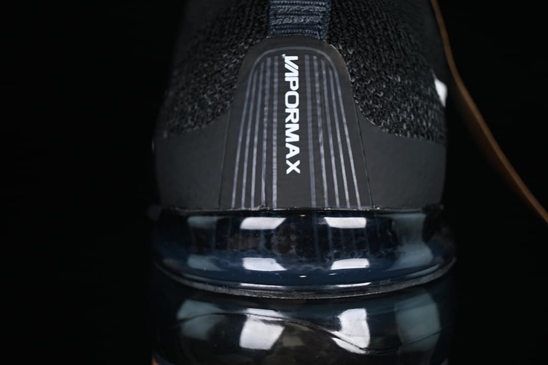 Rear close-up of VaporMax branding above the visible air-cushioned sole.