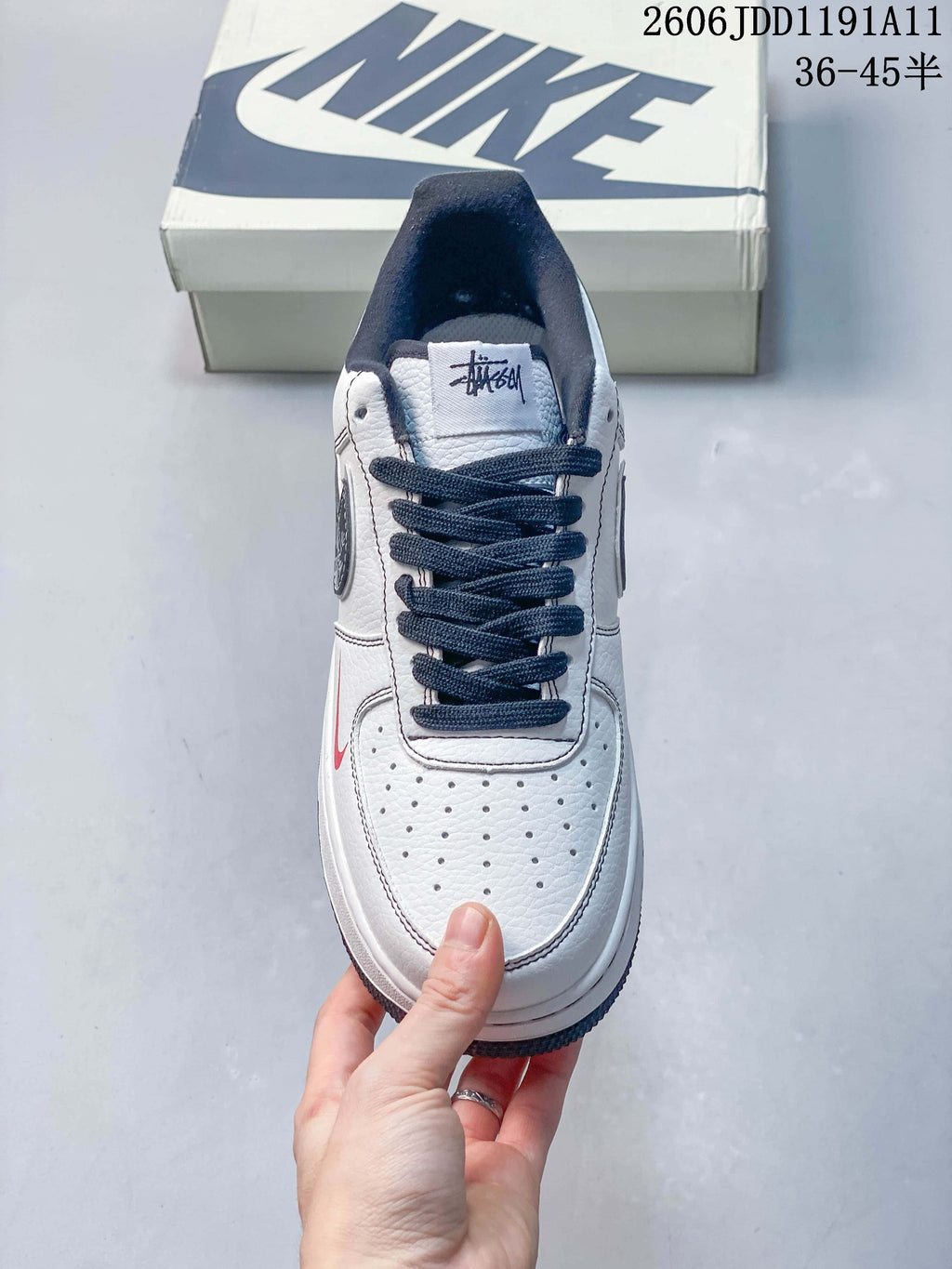 Top view of the sneaker showing its perforated toe and navy laces