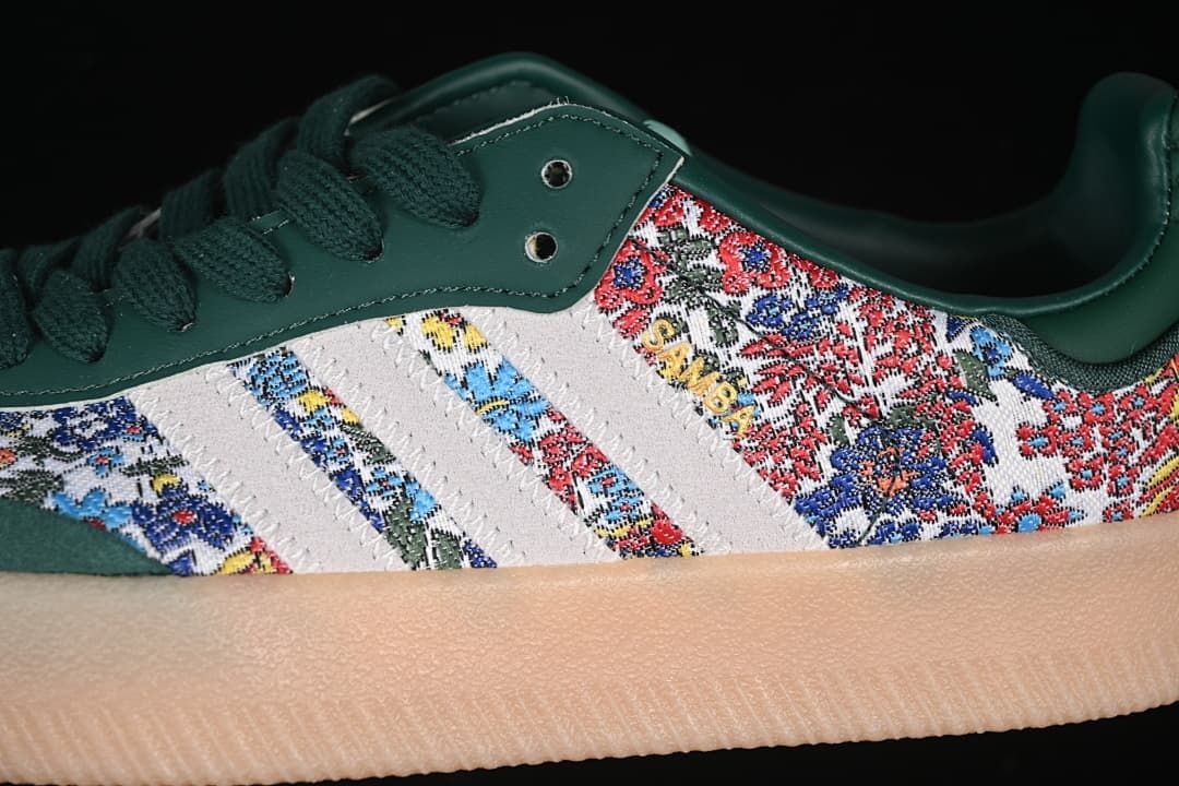 Close-up of the green upper, floral-patterned side panels, light stripes, and gum-toned sole.