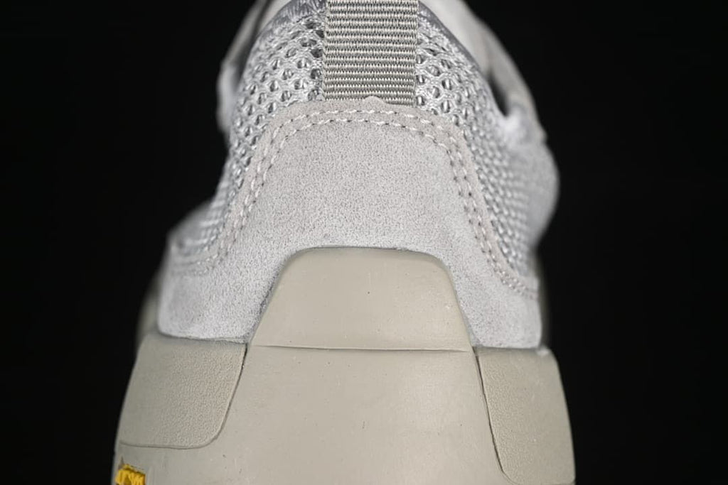 Rear close-up showing the heel pull tab and layered heel construction.