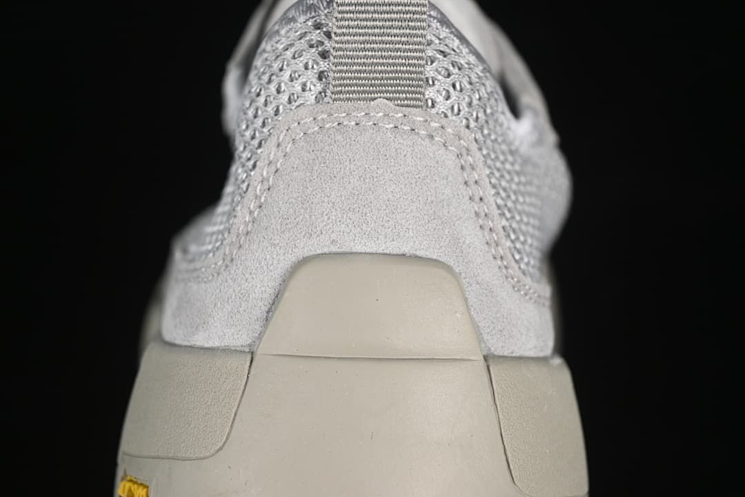Rear close-up showing the heel pull tab and layered heel construction.