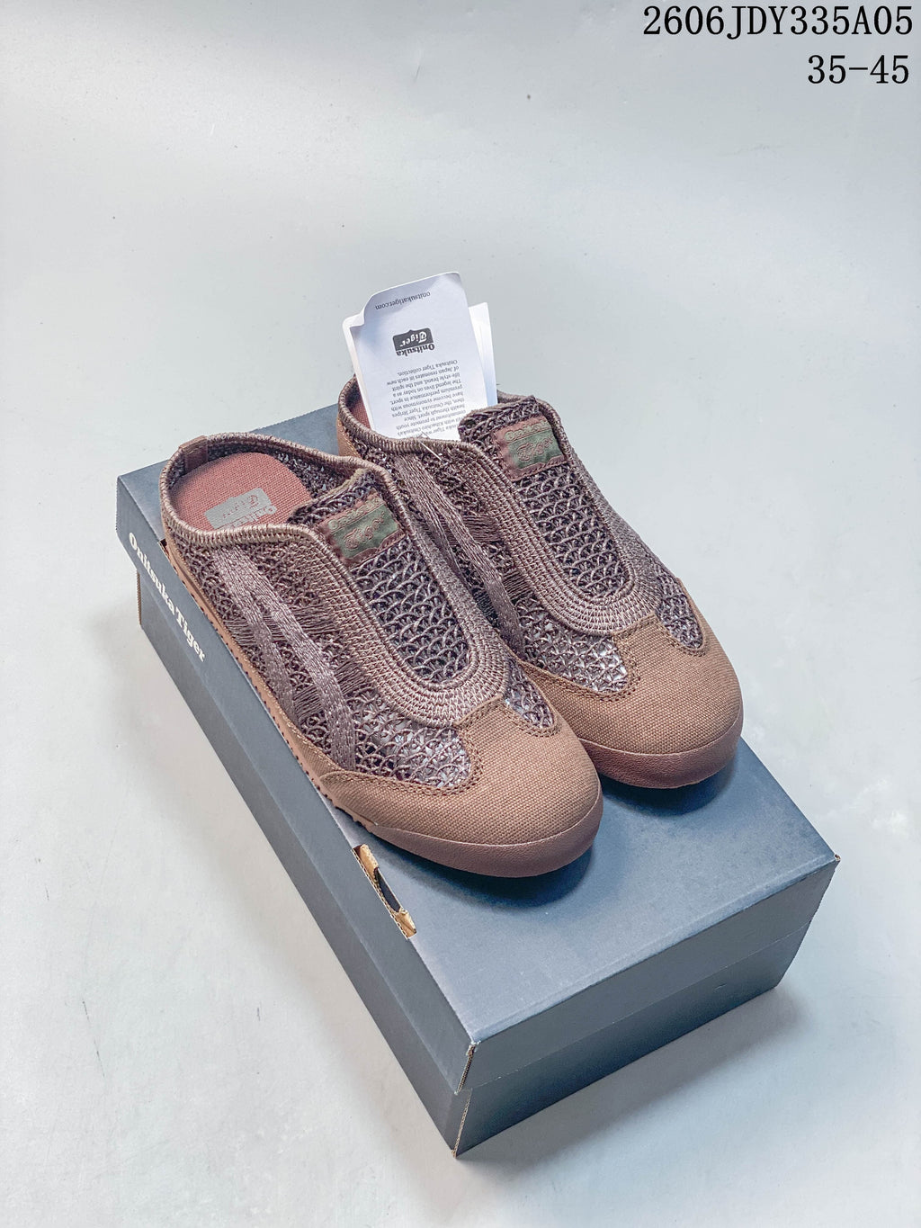 Pair of brown Onitsuka Tiger Mexico 66 Sabot slip-on shoes on a box