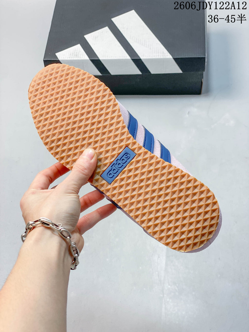Close-up of the sneaker's gum-colored outsole with a textured tread