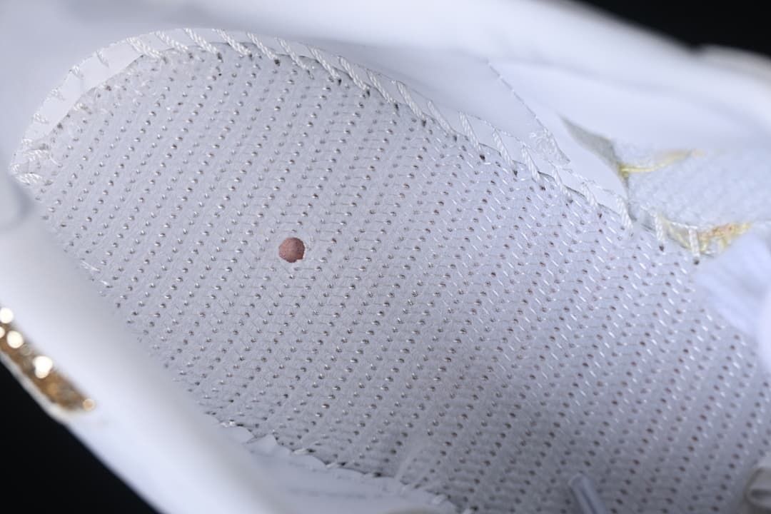 Close-up of the perforated inner surface of the sneaker