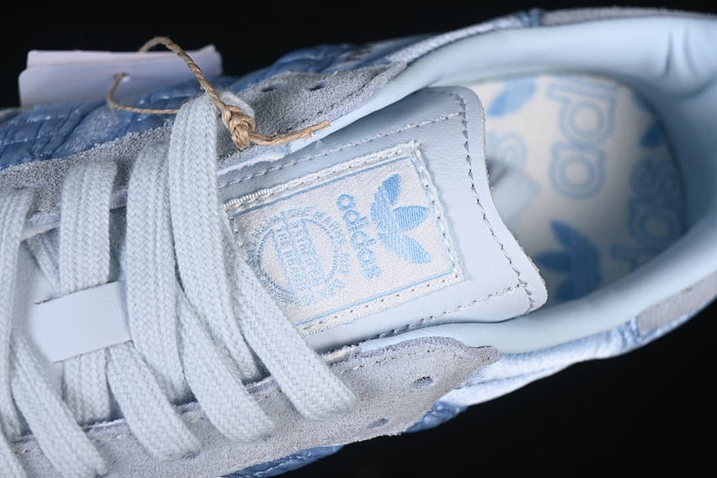 Close-up of tongue branding, laces, and patterned insole