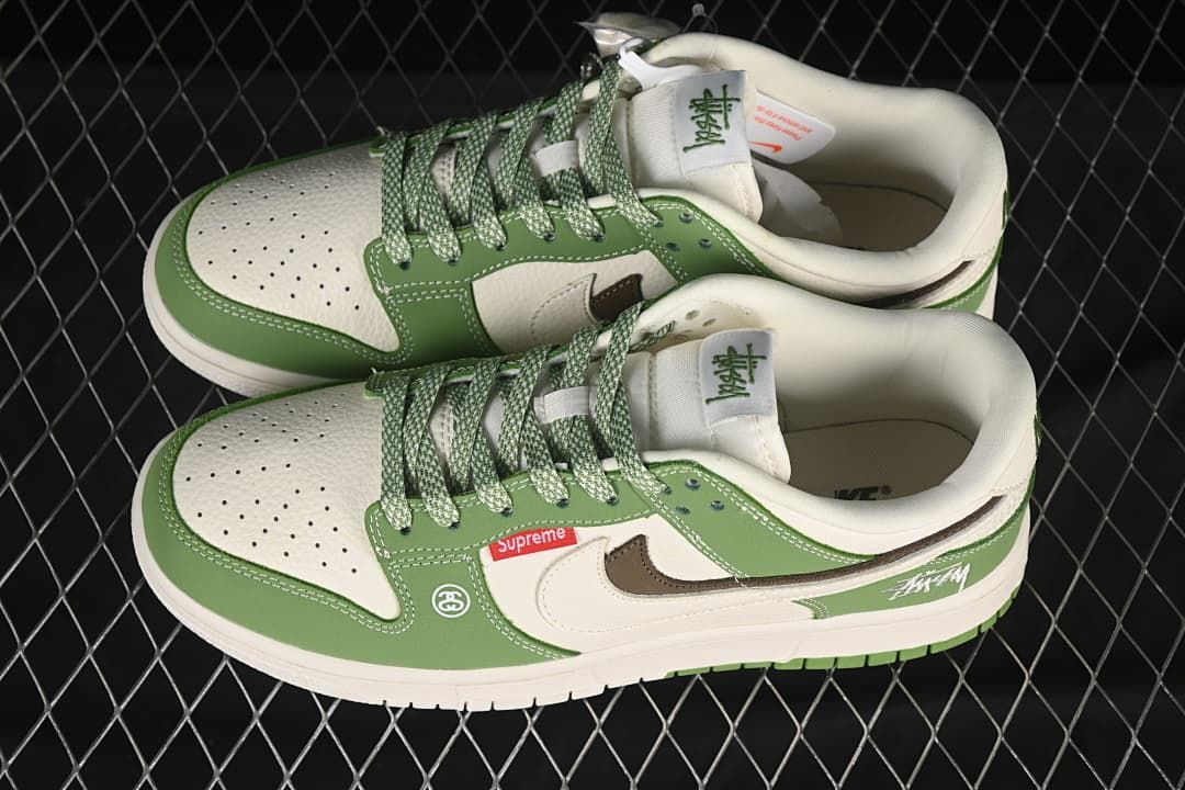 Pair of green and white low-top sneakers viewed from above, showing perforated toe panels and patterned laces