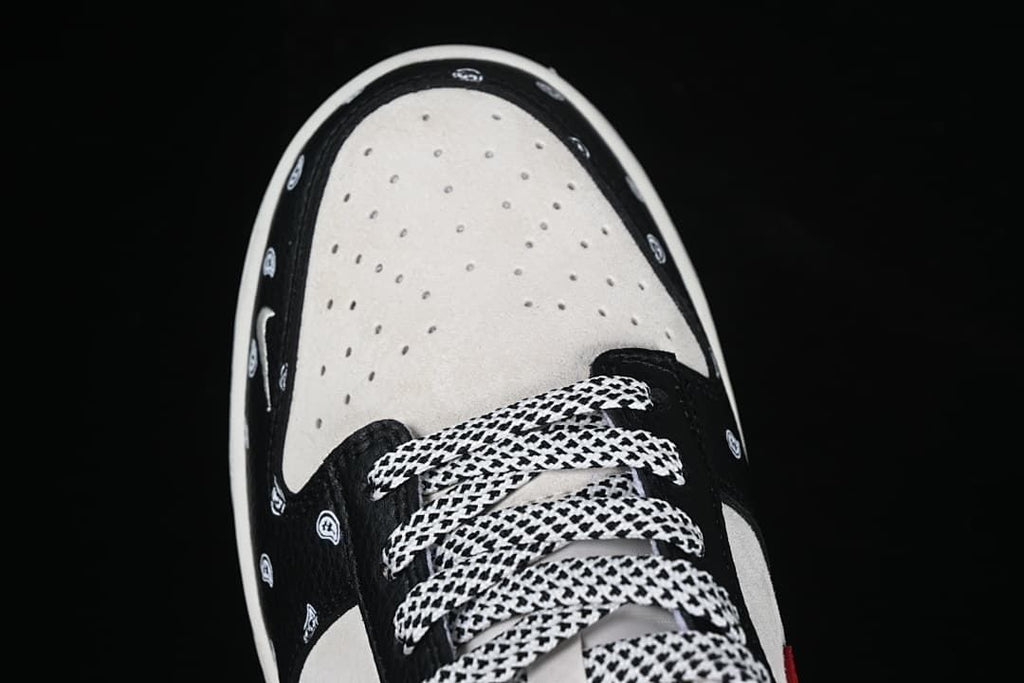 Top-down close-up of the perforated toe box and patterned laces.
