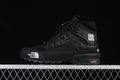 Black mid-height hiking shoe in profile with white logo details