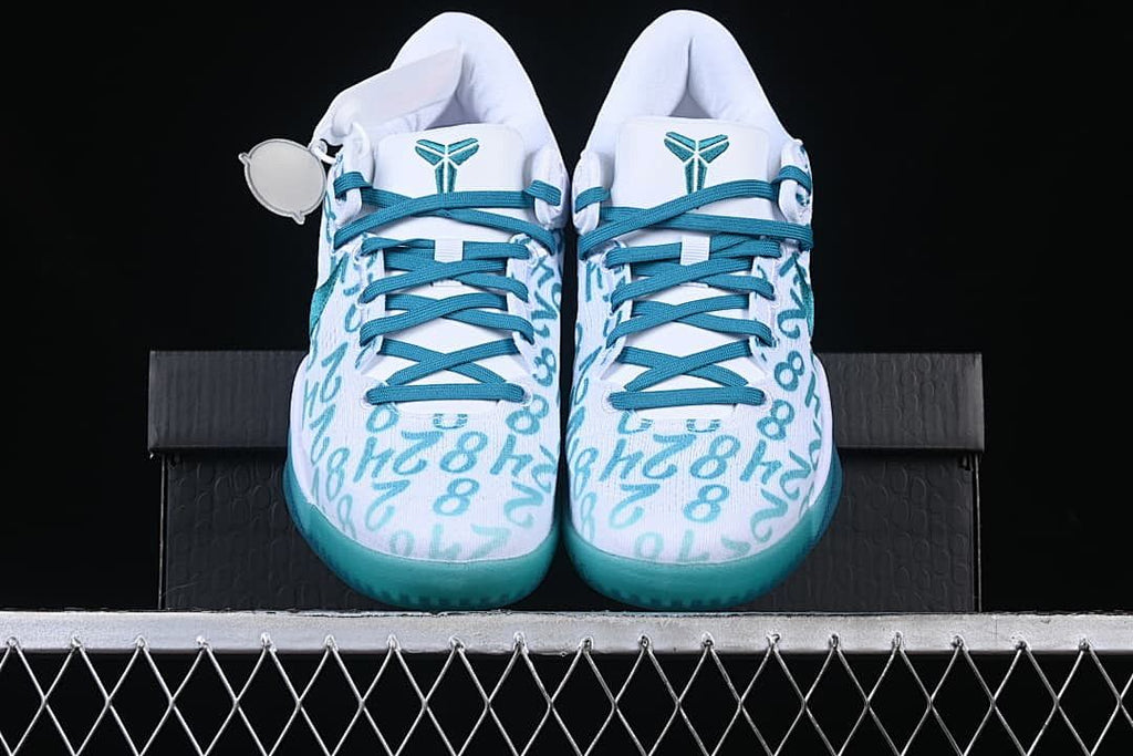 Front view of both shoes with teal laces and patterned uppers
