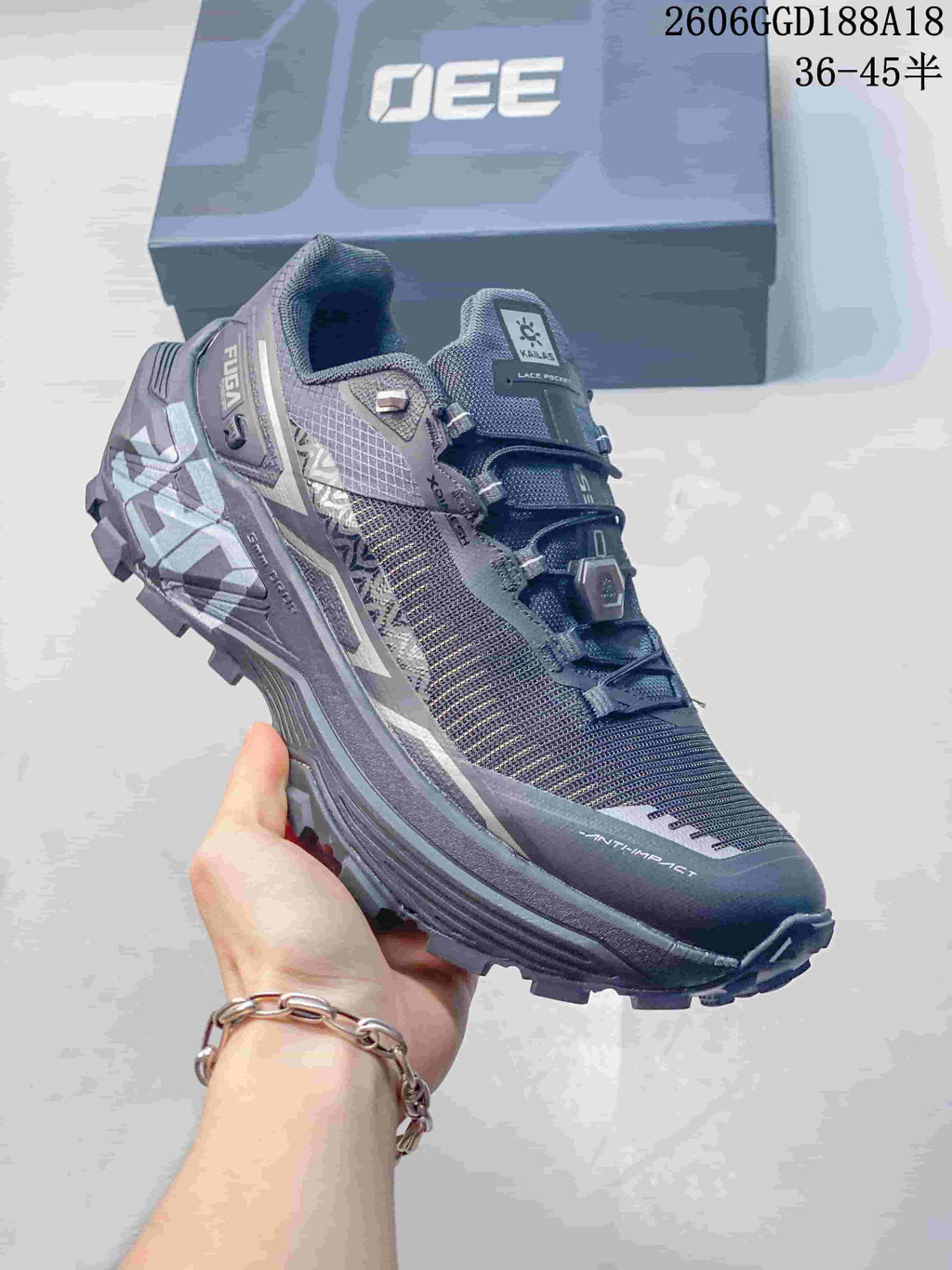 Angled view of the gray KAILAS trail running shoe