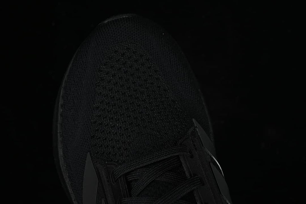 Top view of the knit-patterned toe and laces