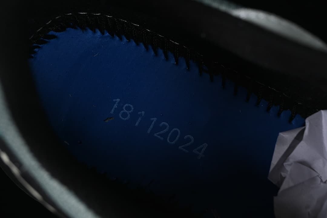 Close-up inside the shoe showing a printed date code.