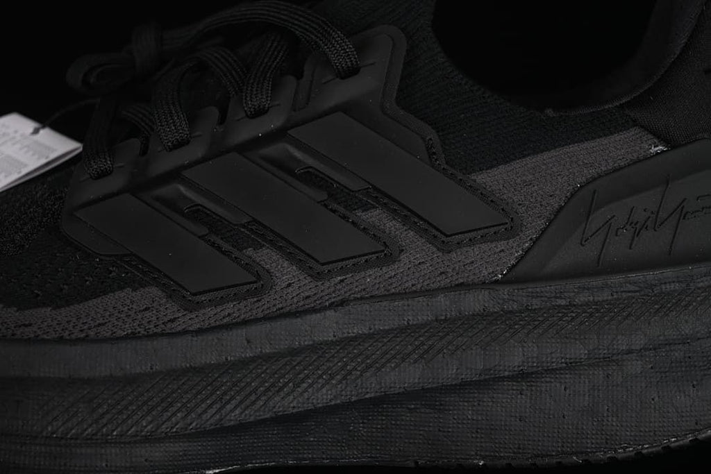 Close-up of the side stripes, laces and midsole