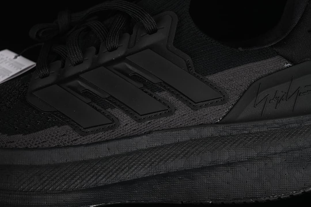 Close-up of the side stripes, laces and midsole