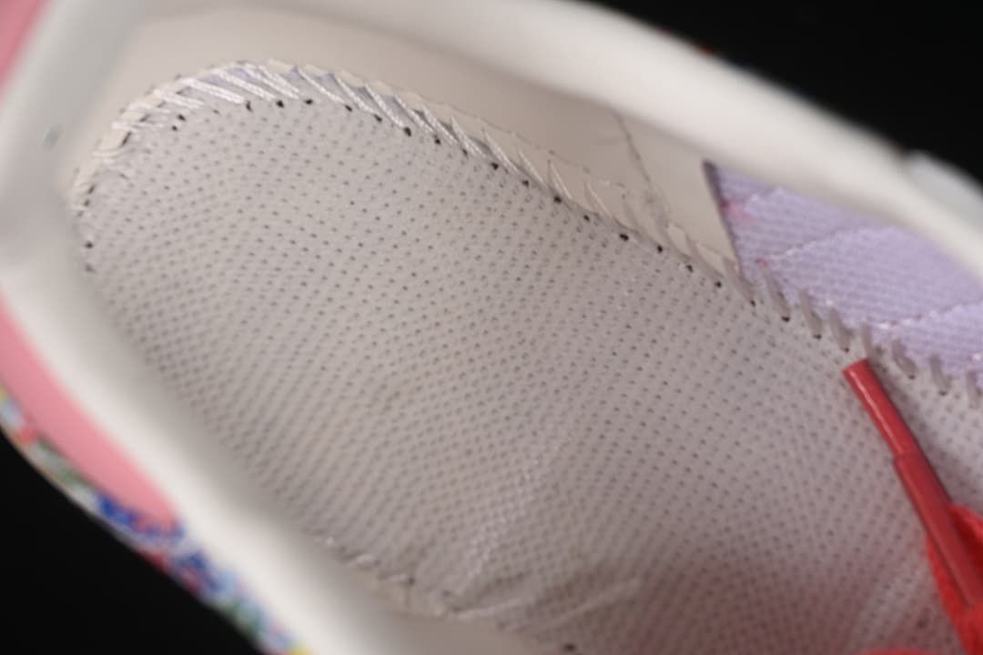 Close-up of the sneaker's light-colored perforated lining.