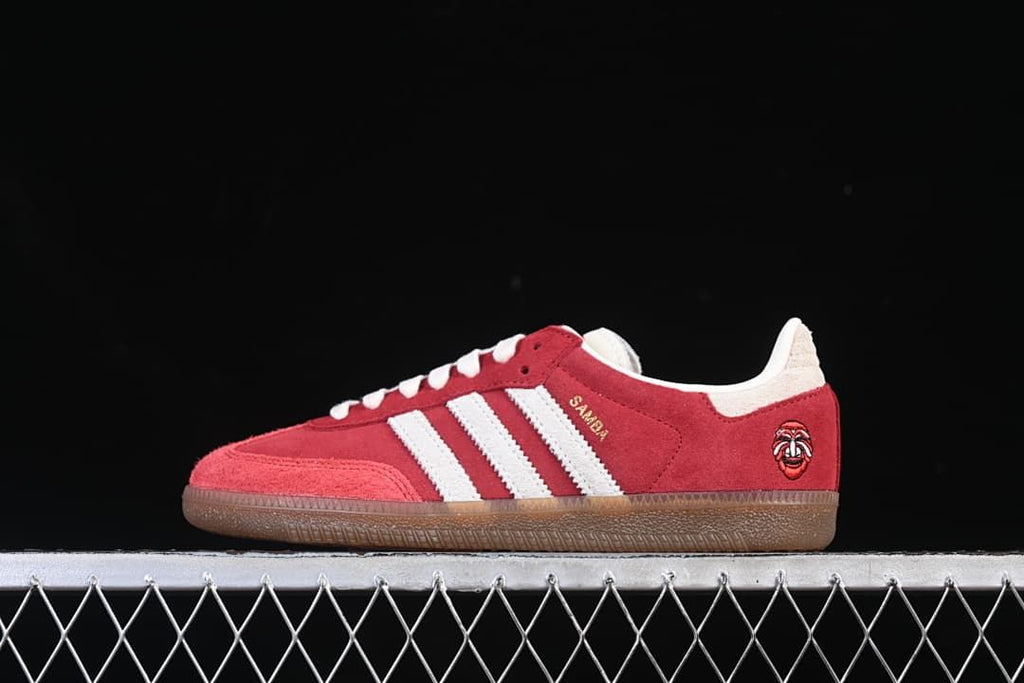 Side view of red and white adidas Samba OG Tal sneaker with gum-colored outsole