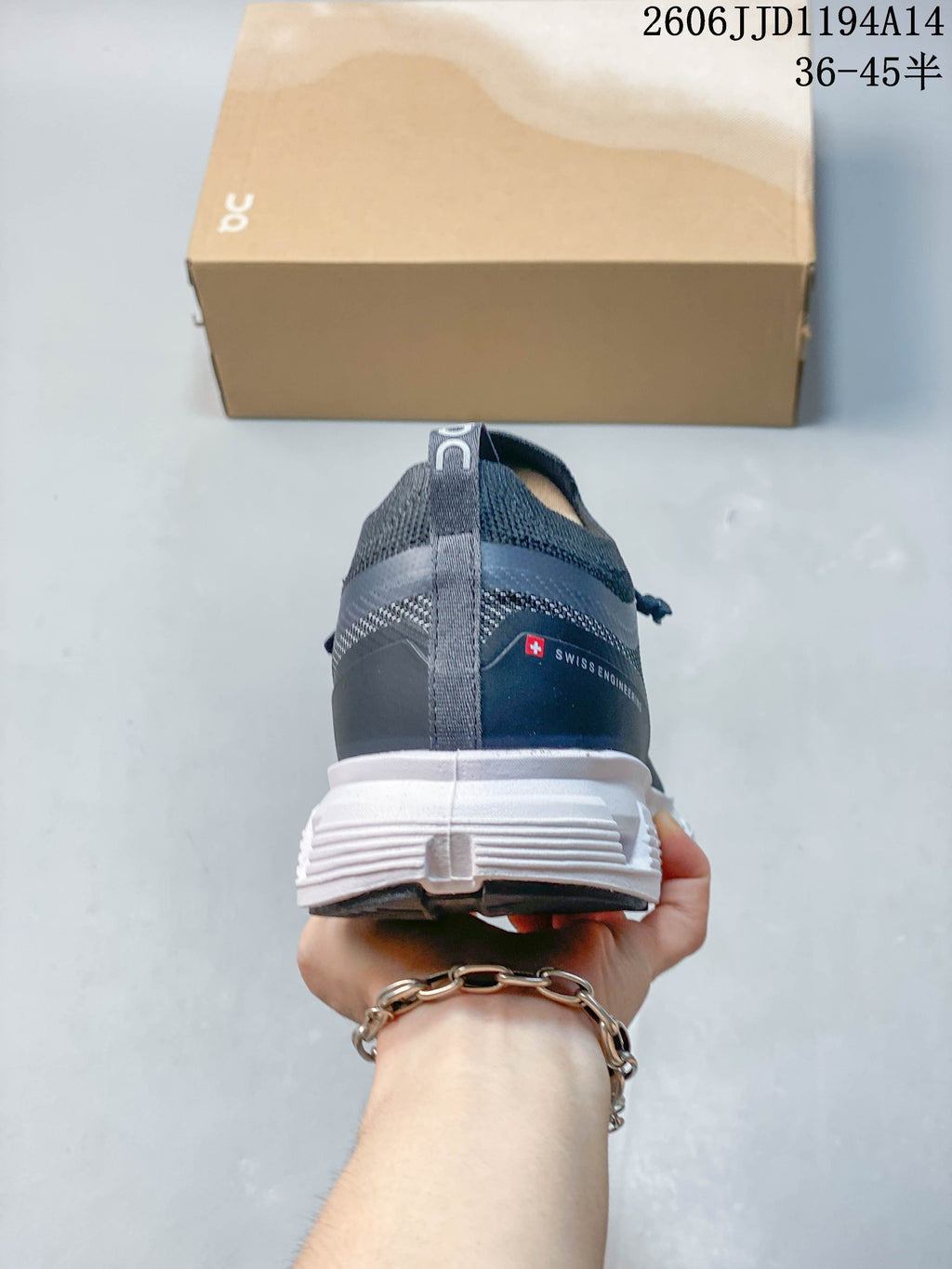 Rear view of the Cloud 6 Versa sneaker with heel pull tab and white outsole
