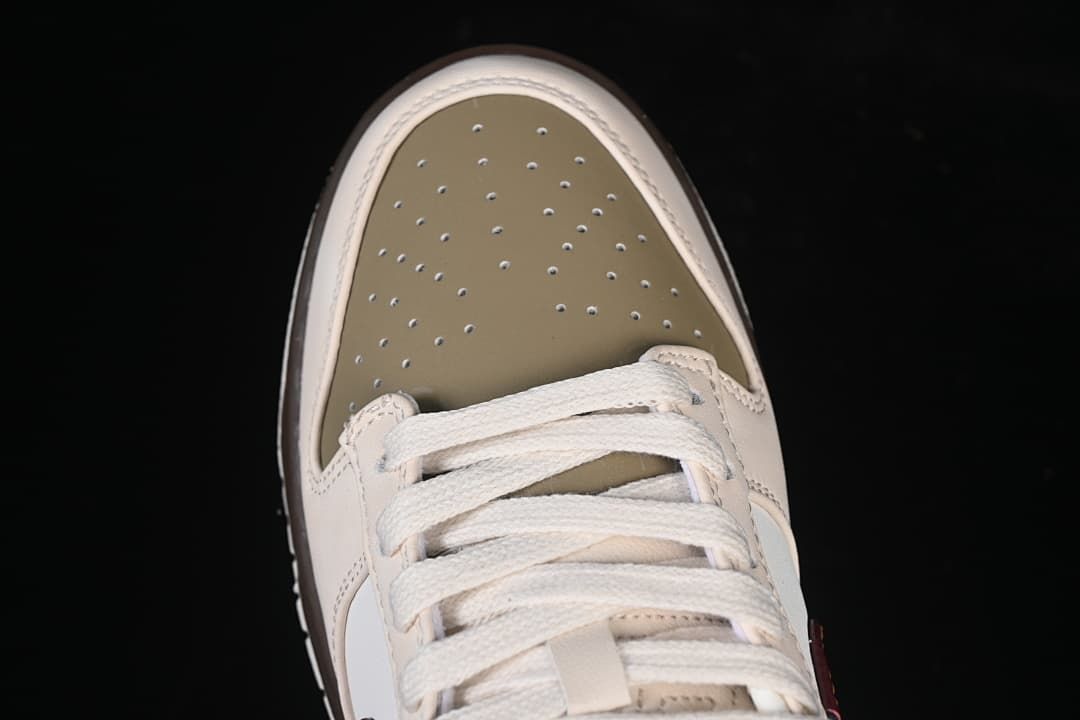 Top view of the olive perforated toe box and cream laces