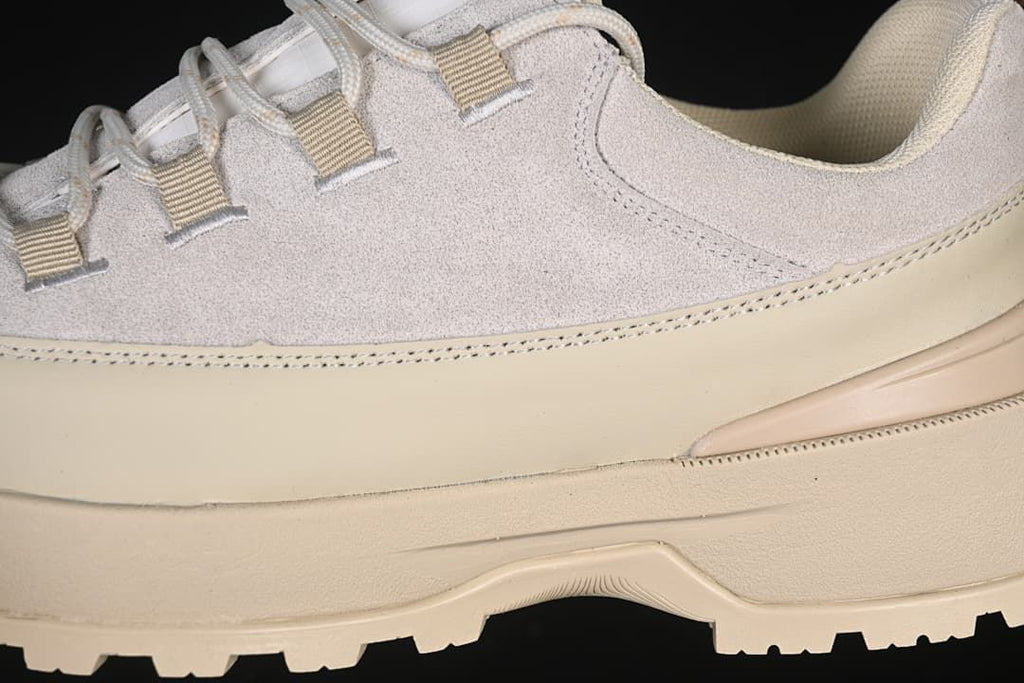 Close-up of side panel, lace loops and outsole