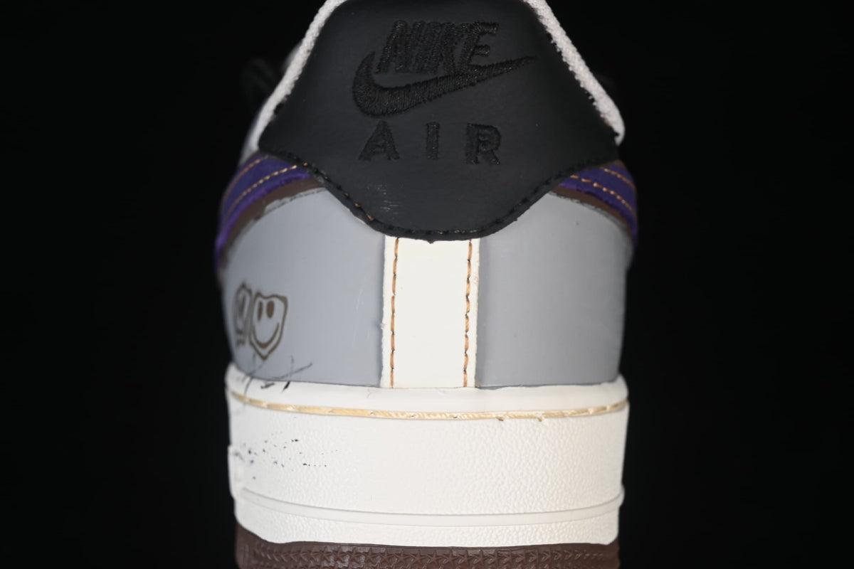 Rear view with black heel tab, gray panels, and purple trim