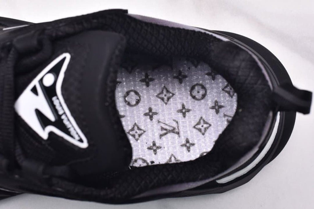 View inside the sneaker showing a patterned insole
