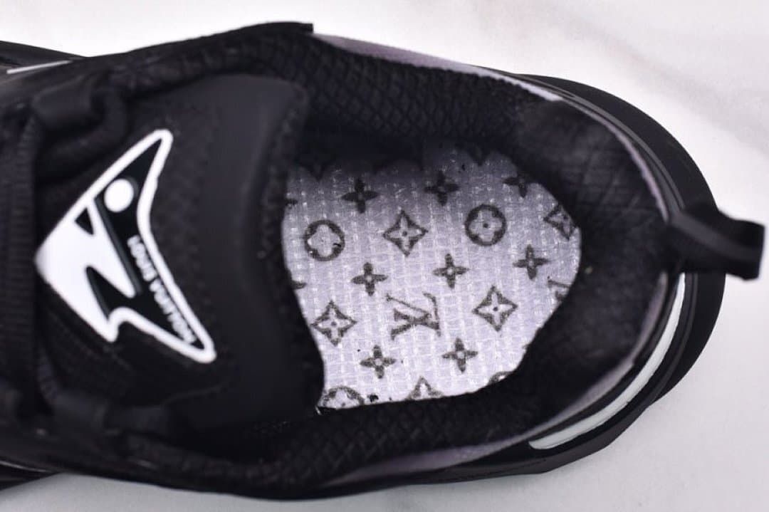 View inside the sneaker showing a patterned insole