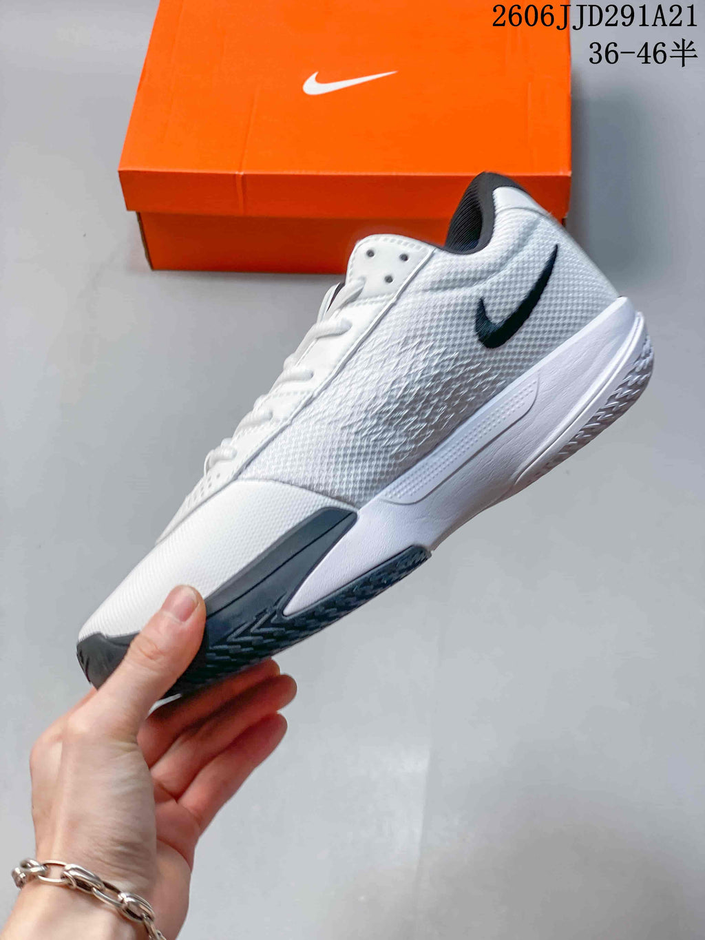 Side view of a white and dark gray Nike G.T. Cut 3 EP basketball shoe.