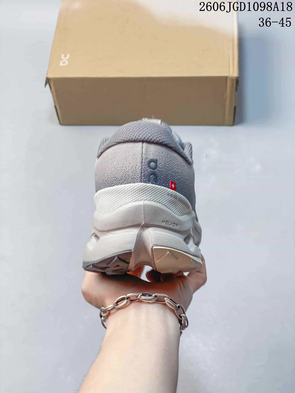 Rear view of the gray sneaker showing the heel and sculpted sole.