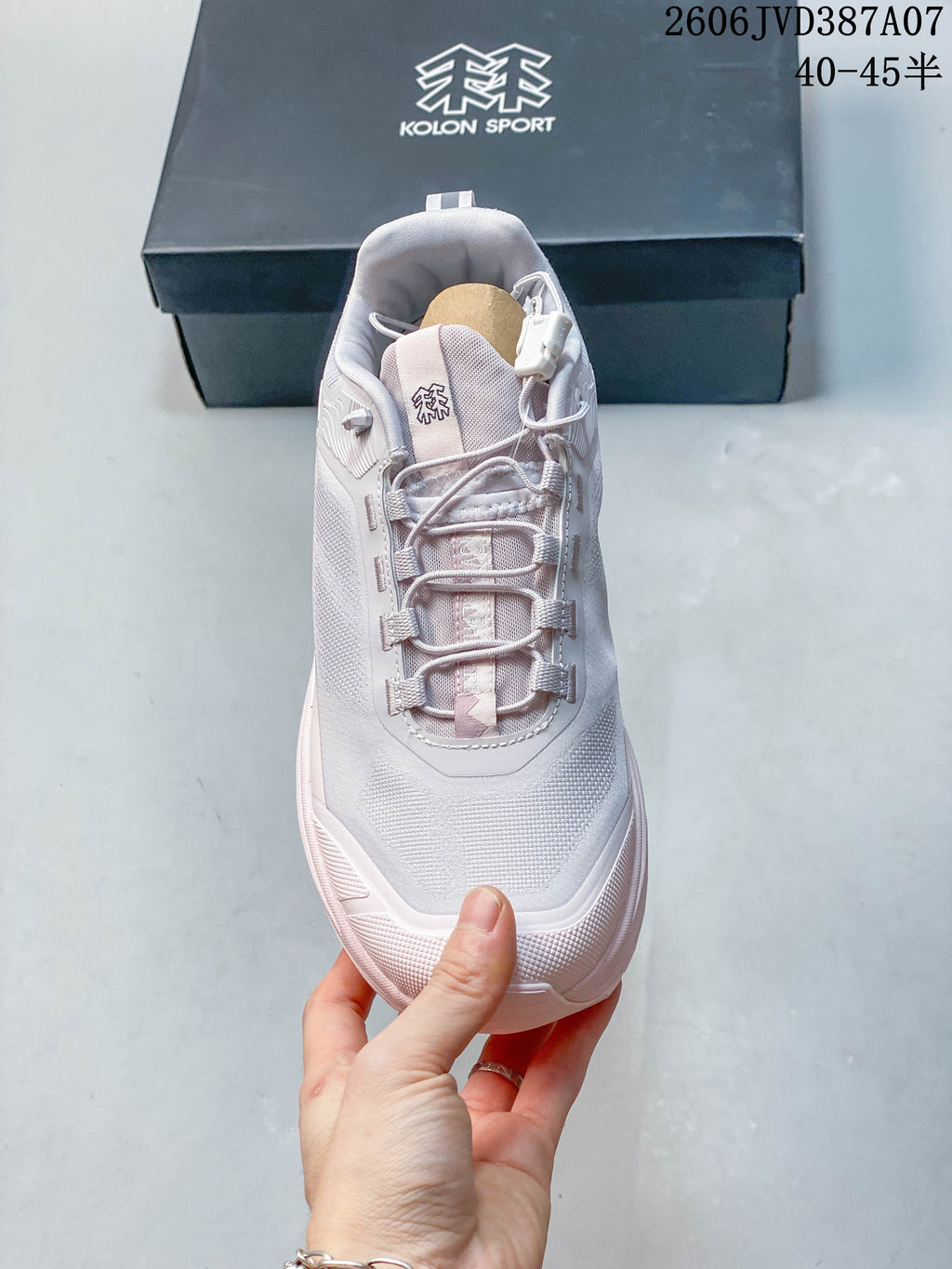 Top view showing the lacing and tongue of a Kolon Sport sneaker