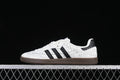 Side view of white adidas Samba OG JQ4748 sneakers with black stripes and a dark brown sole