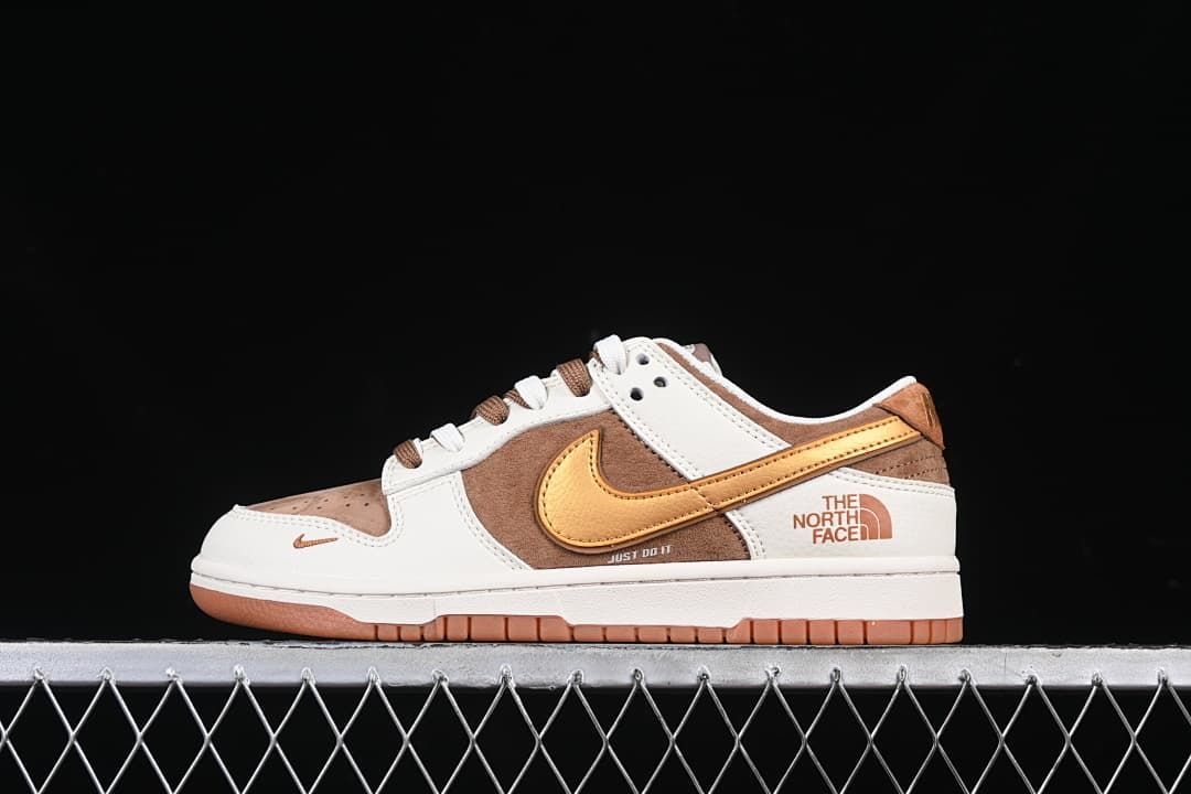Side view of off-white, brown, and golden-yellow Nike SB Dunk Low sneakers