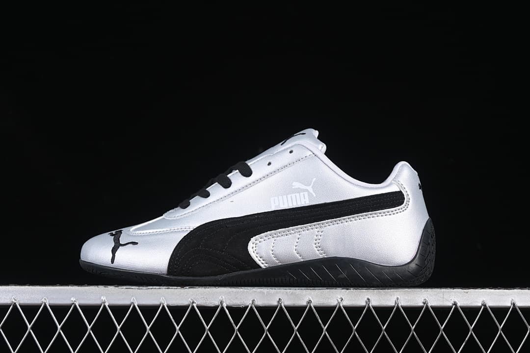 Side view of a silver and black Puma Speedcat OG low-top sneaker.