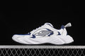 Side view of white and navy Balenciaga Monday low-top sneakers.