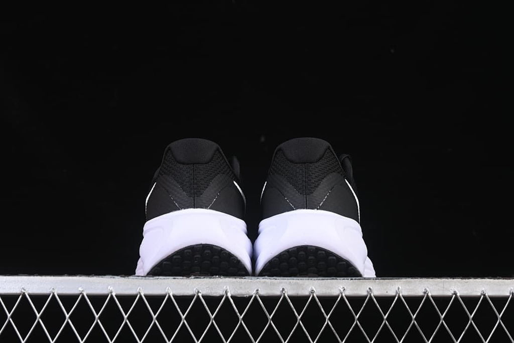 Rear view of the pair showing heel construction and outsole sections