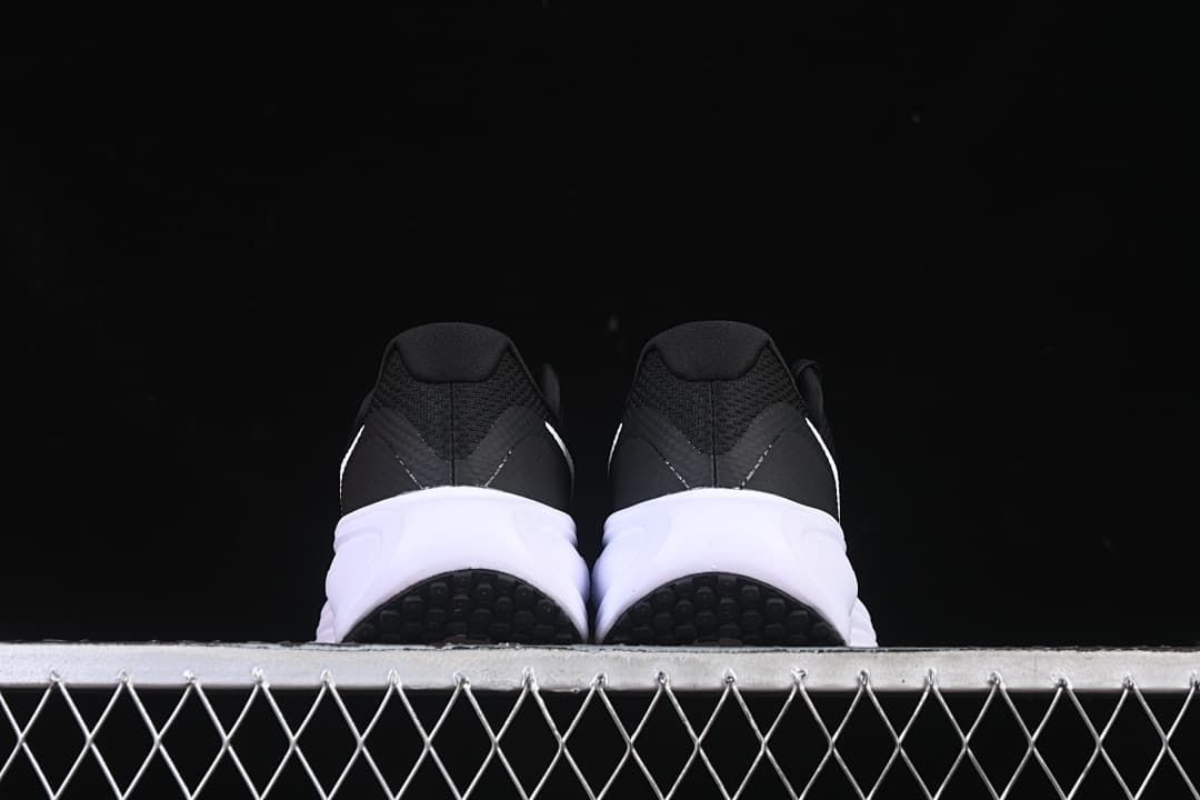 Rear view of the pair showing heel construction and outsole sections