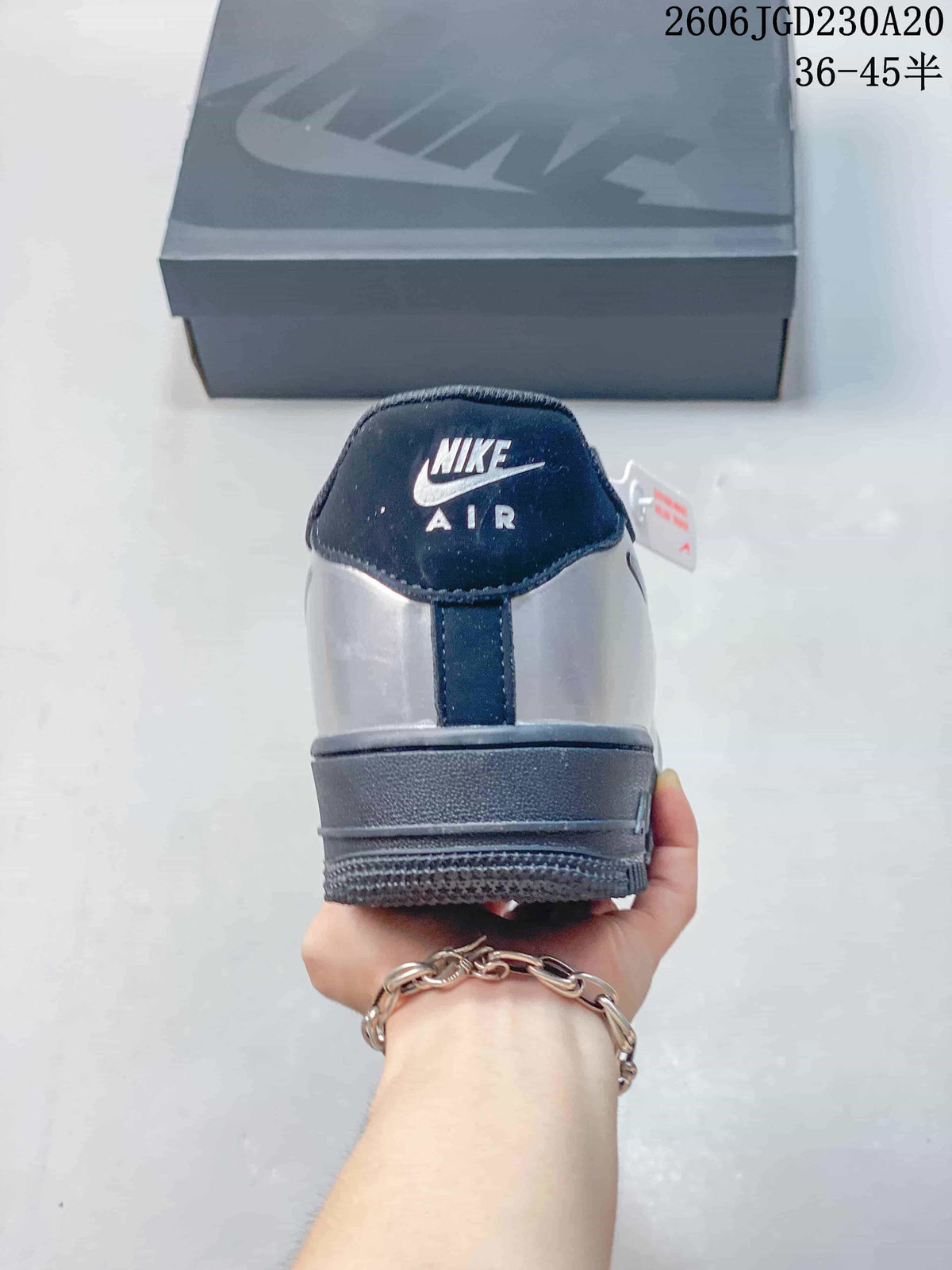 Rear view showing the silver heel and navy Nike Air branding
