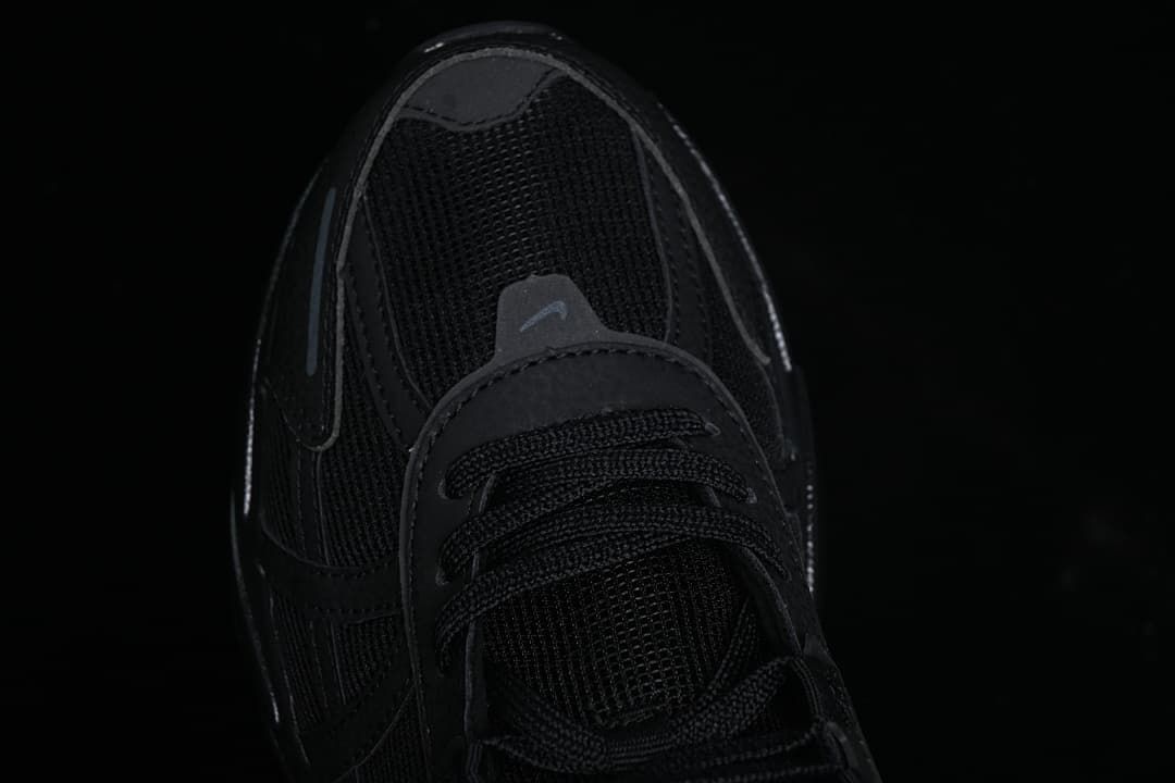 Top-down close-up of the black mesh toe and laces