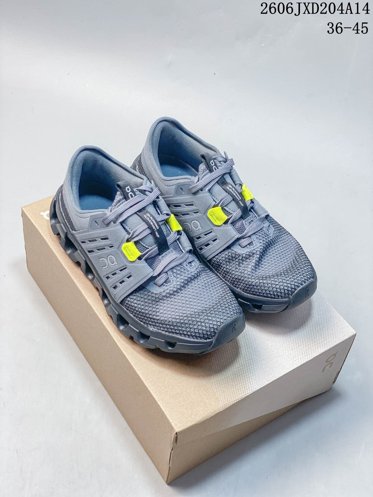 Pair of gray running shoes with neon yellow lace accents